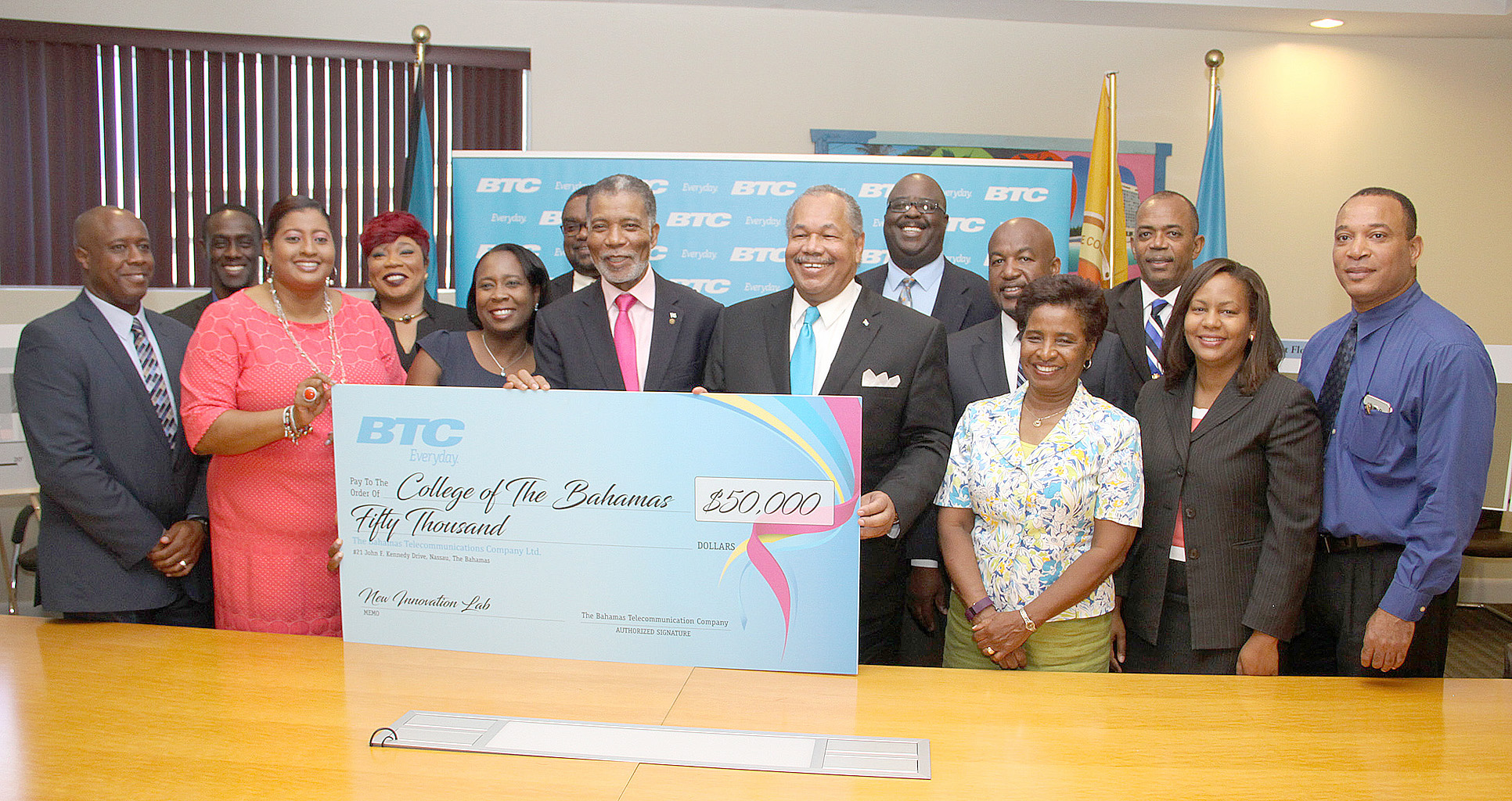  CEO of Bahamas Telecommunications Company Ltd. (BTC) Leon Williams (left) and College of The Bahamas (COB) President Dr. Rodney Smith share handshake following the signing of a Memorandum of Understanding at the College of The Bahamas on July 14, 2016.  They are flanked by representatives of BTC and COB.