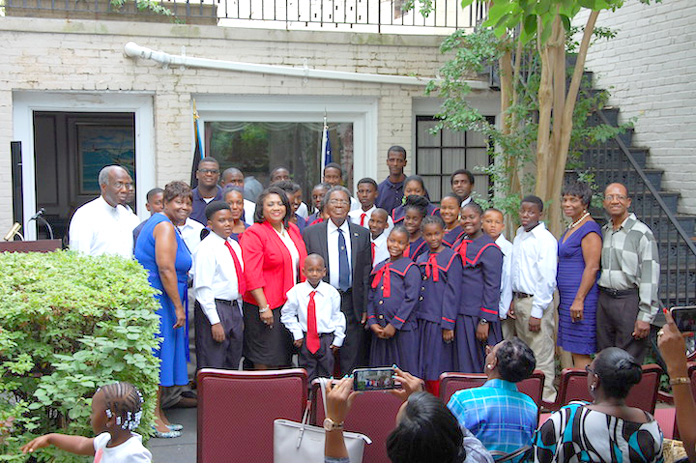 Following their concert on the patio of The Bahamas Embassy, The Bahamas National Children’s Choir, the National Boys’ Choir of The Bahamas and Rhythm ‘N Youth posed for this group photo. At center in front row are His Excellency Dr. Eugene Newry, Bahamas Ambassador to the United States, and Mrs. Paulette Zonicle, Bahamas Consul General to Washington, D.C. Far left is H.E. Carlton L. Wright, former Bahamas Ambassador to Cuba, and second from left, Mrs. Audrey Dean-Wright, Director of the Choir. Far right is Mr. Luicito Bazard, former Haiti Consul to The Bahamas, and second from right, Mrs. Patricia Bazard, General Director of the Choir. 