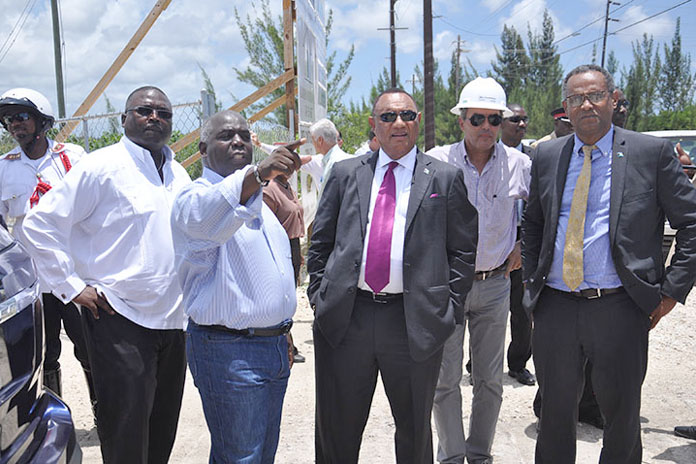 Deputy Prime Minister and Minister of Urban Development, the Hon. Philip Davis (second from left) is seen pointing out something to Prime Minister and Minister of Finance, the Rt. Hon. Perry Christie (centre) at the Fishing Hole Road, Friday, June 24, 2016. Also shown from left are The Hon. Arnold Forbes, Minister of State, Minister of State for the Ministry of Works and Urban Development; Wolfgang Geiger, President, All Bahamas Construction Company, contracted to do the roadwork; and Minister for Grand Bahama, Dr. the Hon. Michael Darville. (BIS Photo/Vandyke Hepburn)