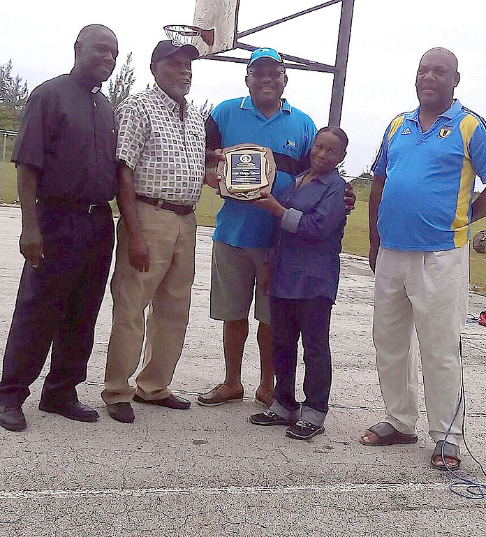 HONOURED – Wilfred Bevans, a long-serving Local Government official, was honoured for more than 20 years of service to Local Government. The presentation took place this past Saturday, July 2, at the YMTA Field in Hunters.  Left to right in the photo are: Deacon Donald Duncombe, Mr. Bevans, Ms. Russell, Mr. Grant, and Simon Lewis, Councilor, West Grand Bahama District.  (Photo/Courtesy Terrance Bain)