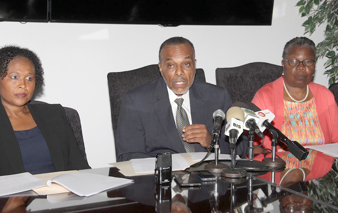 Dr. Glen Beneby, Chief Medical Officer, Ministry of Health (centre) addressing members of the media during a press conference held at the Ministry's Headquarters Tuesday, July 26, 2016. Also pictured (at left) is Dr. Pearl McMillan, Director of Public Health and Maisie Evans, Permanent Secretary, Ministry of Health (far right). (BIS Photo/Letisha Henderson)