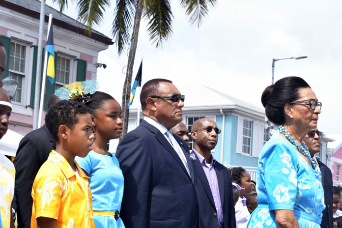 All stand at attention during the playing of the National Anthem - March on, Bahamaland - by the Royal Bahamas Police Force Youth Band, during the National Pride Day and Flag Raising Ceremony. Pictured are the Rt. Hon. Perry Christie, Prime Minister and Her Excellency Dame Marguerite Pindling, Governor General. (BIS Photo/Derek Smith)