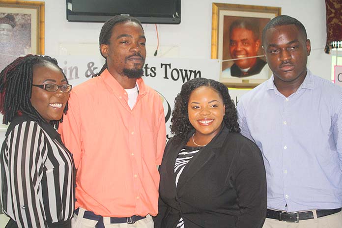 Four Bain and Grants Town residents are able to pursue higher learning as the first recipients of the Bain and Grants Town Scholarship Fund. From left to right are: Nadia Esteve, AA Accounting, Galilee College; Vandeco Stuart, certificate in Electrical Installation, BTVI; Terwaashna Robinson, AAS, Office Administration and Michael Clarke, BA Accounting, COB.