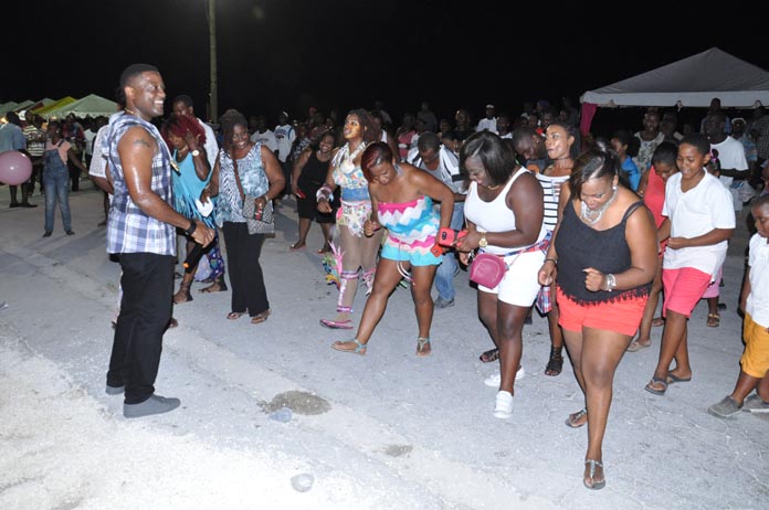 JOINING IN THE FUN - The Ministry of Tourism's 2nd Annual Junkanoo Summer Festival closed out in West End, Grand Bahama, on Saturday, August 20, 2016.  At the closing, the Ministry of Tourism was able to attract some 400 tourists to enjoy an incredible experience. Ms Betty Bethel, Director of Tourism, said she has no doubt they will share their experience with friends and family when they return home. Seen is one of the guests enjoying the festival. (BIS Photo/Vandyke Hepburn)