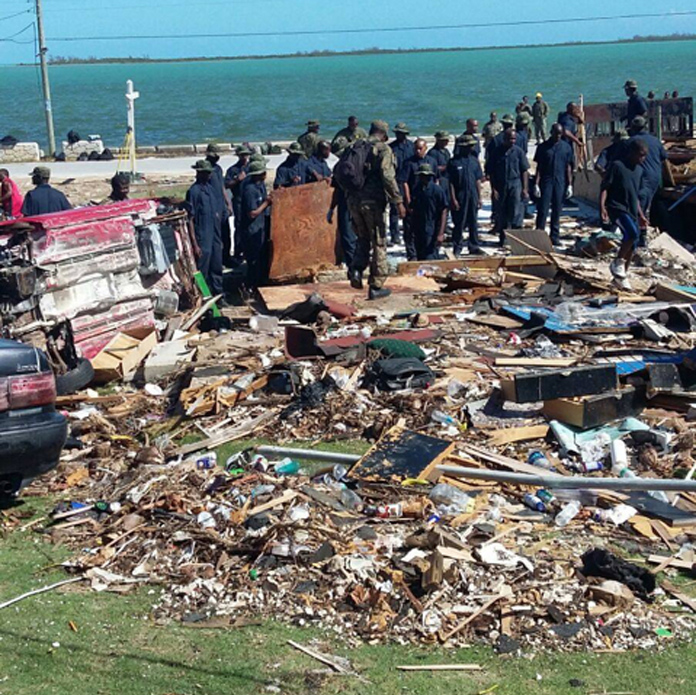 Marines of the Royal Bahamas Defence Force and other volunteers engaged in a massive clean-up effort of debris in North Andros, which experienced Hurricane Matthew as a Category 4 Storm on Thursday, October 6, 2016. (PHOTO/Leonard Dames Jr/NEMA)