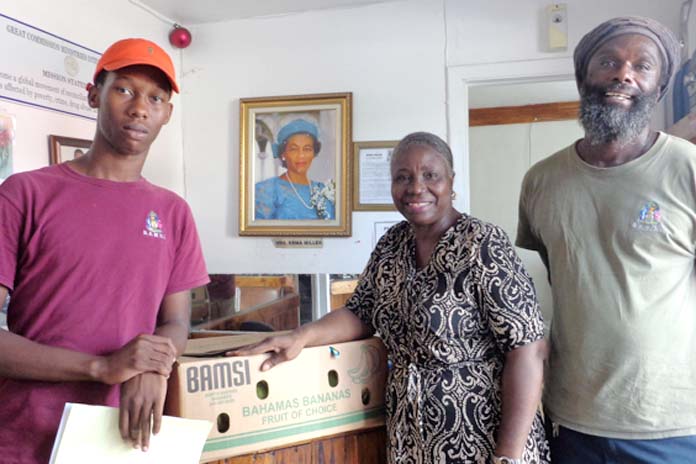 Executive Director of Great Commission Ministries International Minalee Hanchell (centre) was on hand to receive BAMSI’s bananas. She said the agency typically feeds some 300 persons a day, but as a result of Matthew they have experienced an increase in the number of persons seeking assistance. Also pictured are members of the BAMSI’s distribution team, Devontae Thurston (left) and Cambridge Cooper (right) 