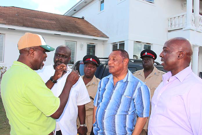 George Wilson presents to Prime Minister Christie the state of his community following Hurricane Matthew.