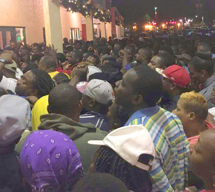 Hundreds wait outside BTC's Southwest Plaza store from 4am this morning for the BTC Black Friday Sale....