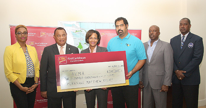 CIBC FirstCaribbean donated $100,000 to the Hurricane Matthew recovery and restoration efforts, during a presentation at the National Emergency Management Agency on Thursday, November 17, 2016. Pictured left to right are: Maya Nottage CIBC FirstCaribbean Marketing & PR Manager; the Rt. Hon. Perry Christie, Prime Minister; Marie Rodland-Allen, CIBC FirstCaribbean Managing Director; Gowon Bowe, member of the disaster relief committee responsible for accounting and fund raising; the Hon. Shane Gibson, Minister responsible for Recovery and Restoration; Captain Stephen Russell, Director, NEMA. (BIS Photo/Patrick Hanna)