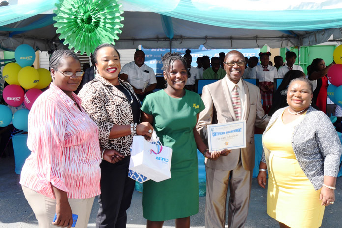 BTC hands out special awards to former students. Left to right: Proud Parent, Eldri Mackey (VP, Marketing), Jordan Khalfani (Outstanding Student), Howard Newbold (Education District Superintendent), Cheryl Samuels (Principal) 