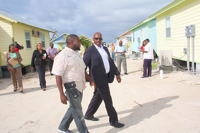 Minister with responsibility for Hurricane Relief and Restoration the Hon. Shane Gibson, centre, views the aftermath and restoration of Chub Cay.  (BIS Photo/Patrick Hanna)