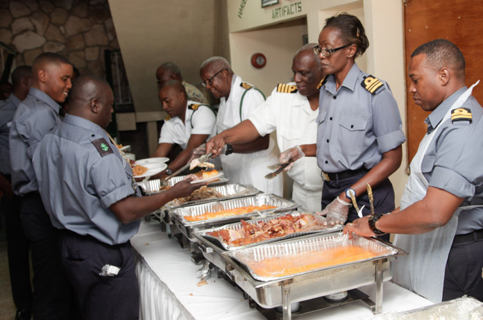 Defence Force officers serving the Marines during the Thanksgiving luncheon held at the Defence Force Base. 