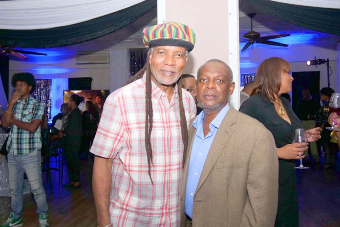 BTC’s CEO, Leon Williams channelling “Bob Marley” and Kevin Basden, former General Manager of B.E.C. at the BTC 70’s Inspired Corporate Event.