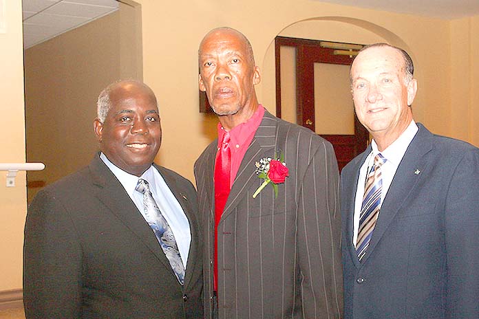 Ambrose Cargill (centre) began working at the age of 14 as a Carpenter Helper at the Ministry of Works and Urban Development and retires after 45 years as a Superintendent in the Carpentry Shop. He is shown with the Hon. Philip Davis, Deputy Prime Minister and Minister of Works and Urban Development (left) and Colin Higgs, Permanent Secretary, (right). (BIS Photo/Patrick Hanna).