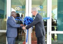 Prime Minister Davis congratulates CG Atlantic at Freeport office opening
